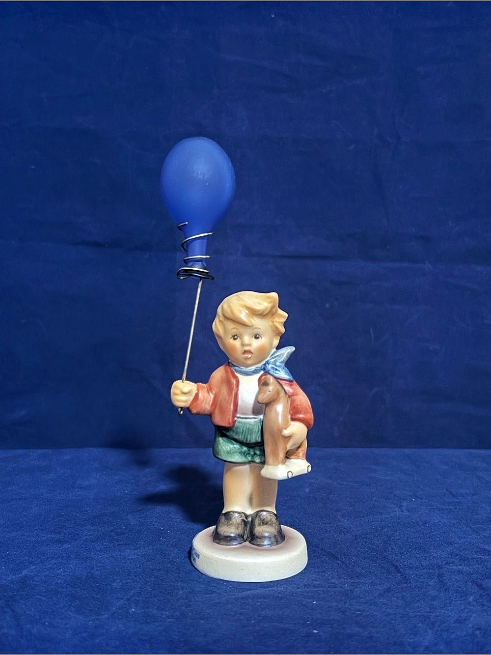 M.I. Hummel “Carnival Fun” #375 HUM 239/E Boy with Blue Balloon & Wooden Horse